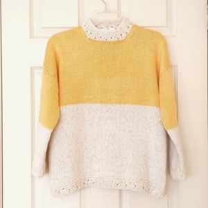 NWOT. Woman's Two colors sweater with crochet trim and sparkling.